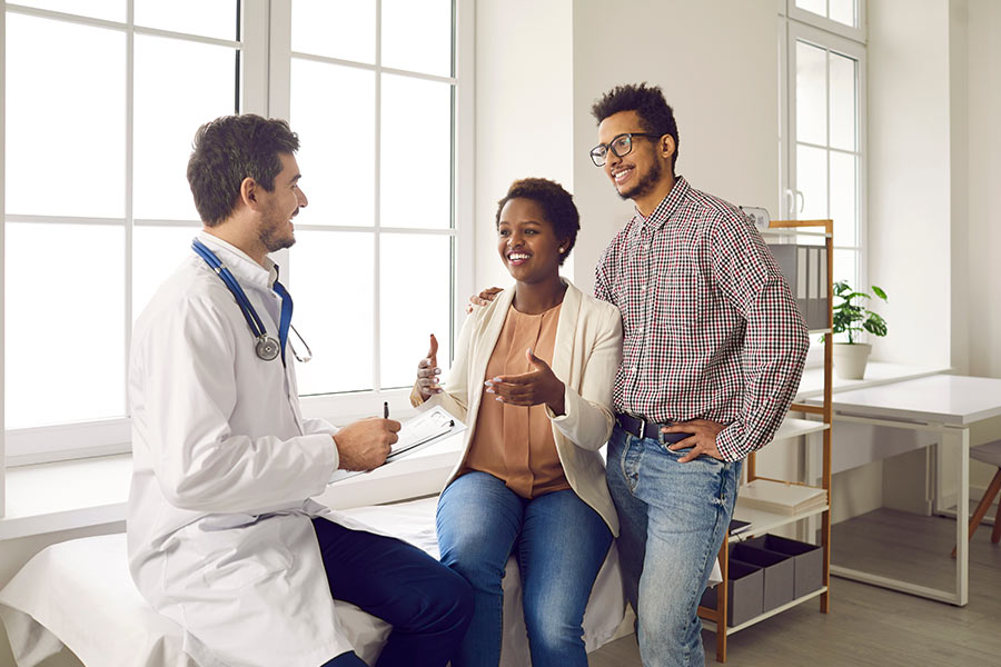 Photo of a couple talking with a doctor