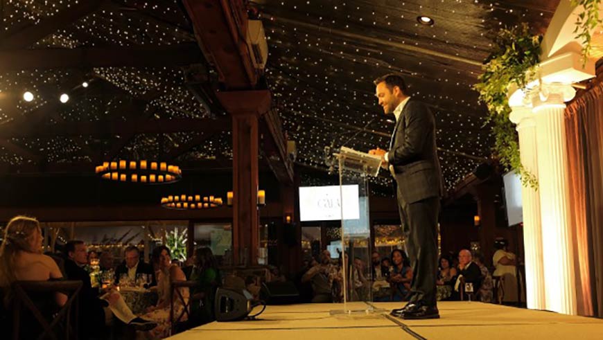 Photo of Pete Proimos speaking at the Filotimo Foundation Gala 2025